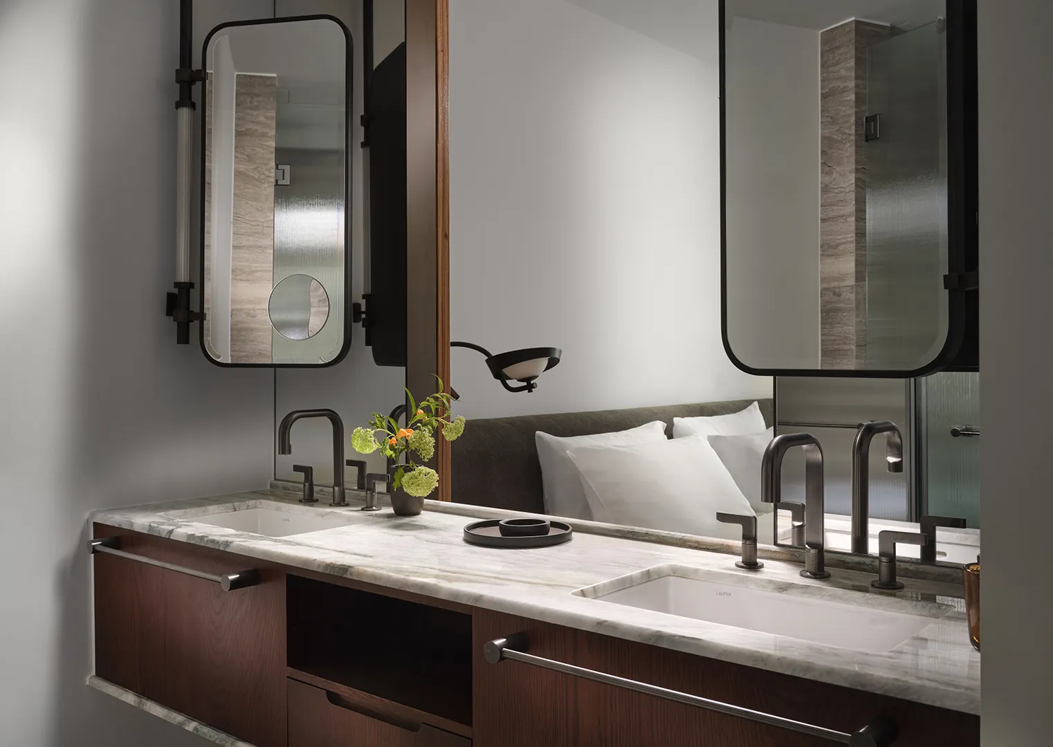 The twin washbasins, beneath their mirrors