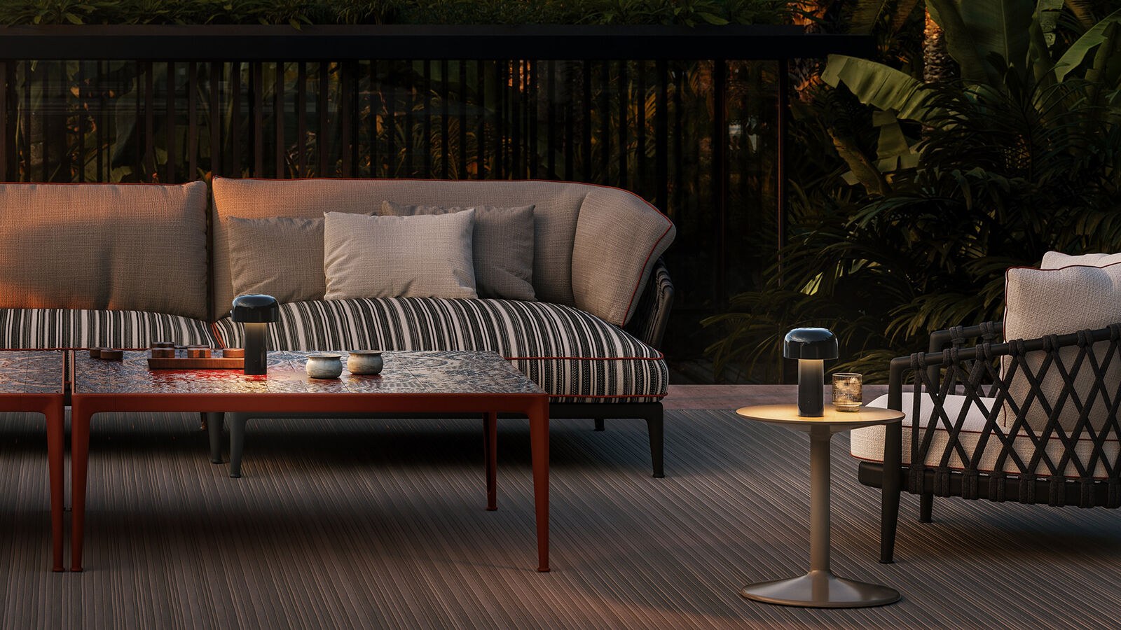 Terrace at dusk with the portable lamp on a side table