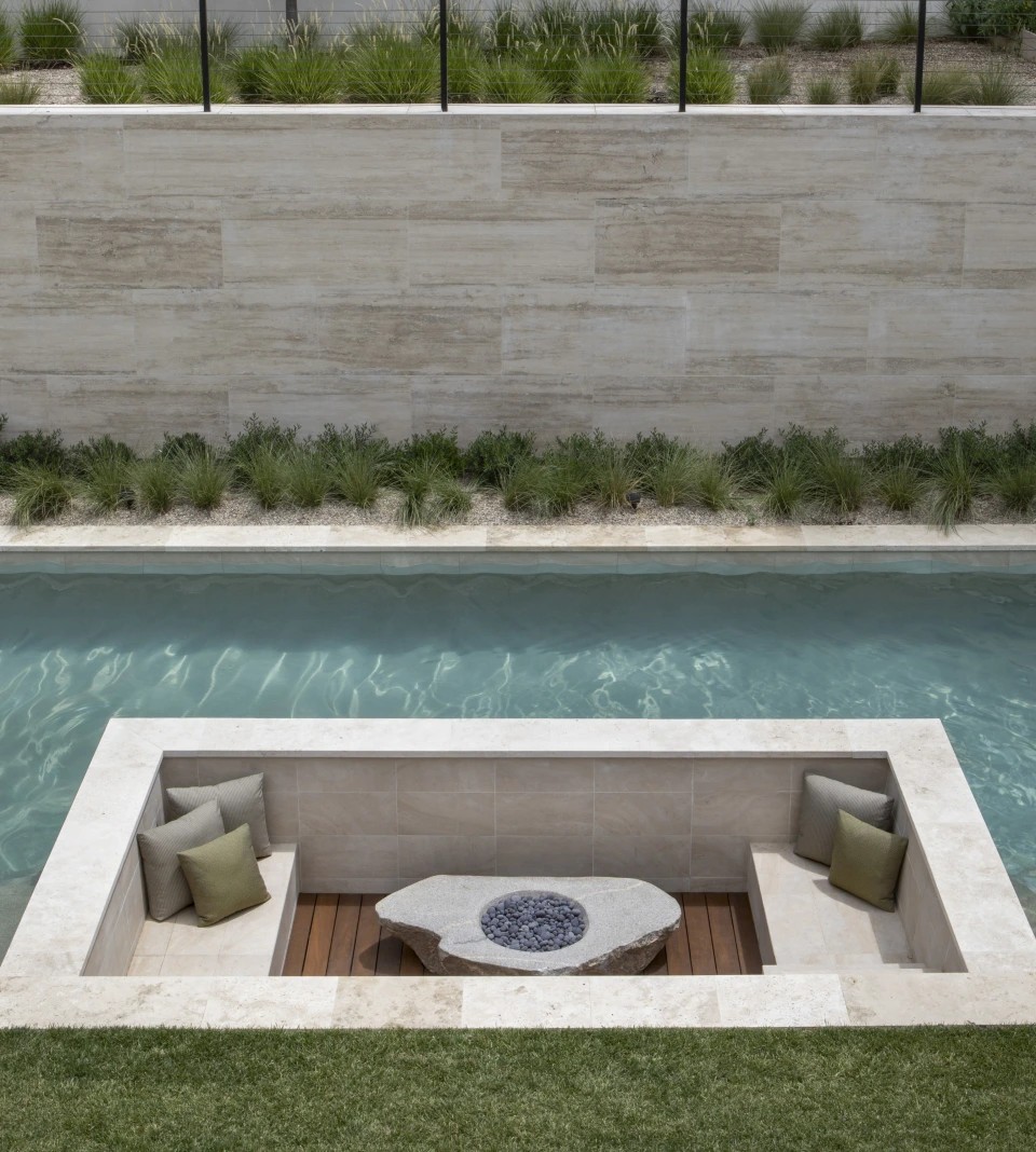 The sunken seating area beside the pool