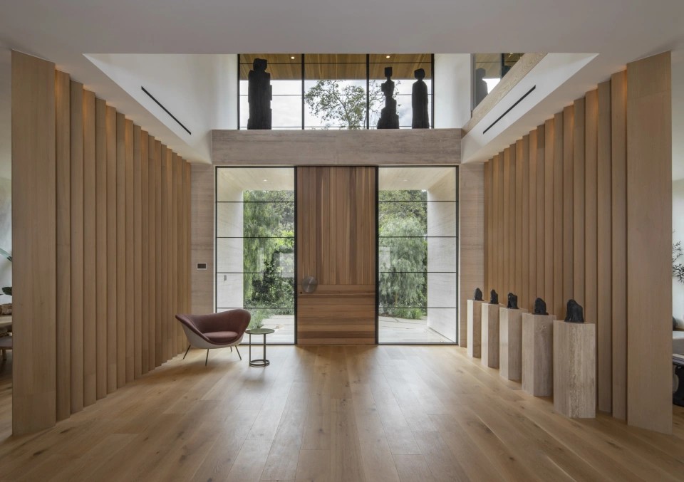 The double-height entrance hall, lined in oak