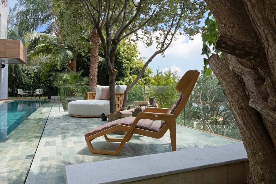 The pool terrace, under the trees