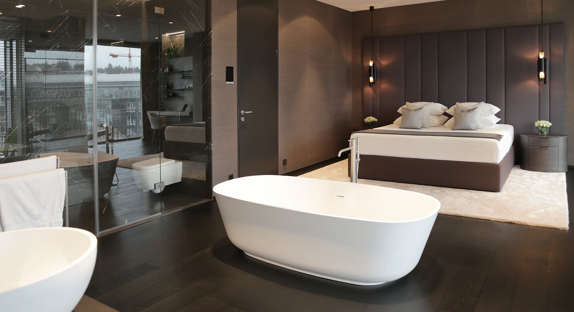 The bath, with the bedroom beyond
