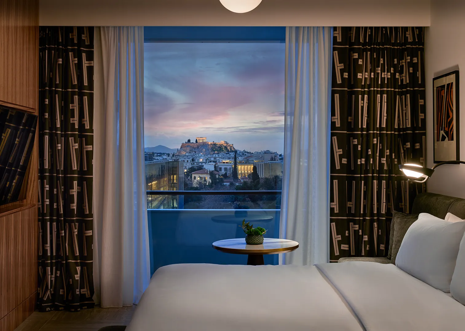 A guest room, with Athens at dusk