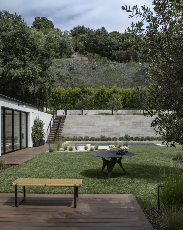 The garden, with the deck and lawn below the retaining wall