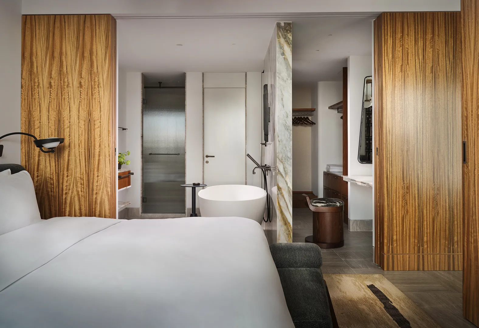 A bathroom, with the bath beyond