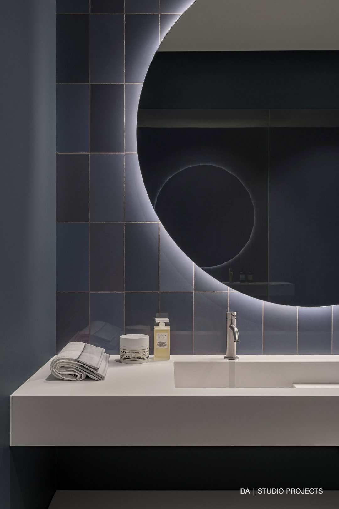 Bathroom vanity with round mirror