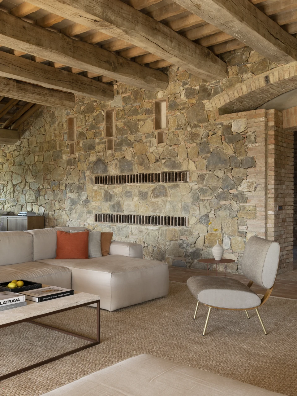 The living room against the original stone wall
